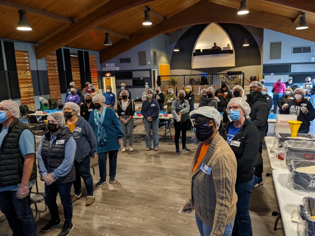 Richmond church volunteers pack over 10K meals to feed people