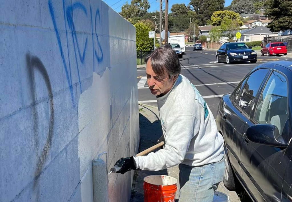 Supervisor grabs paint brush in bid to support family battling graffiti