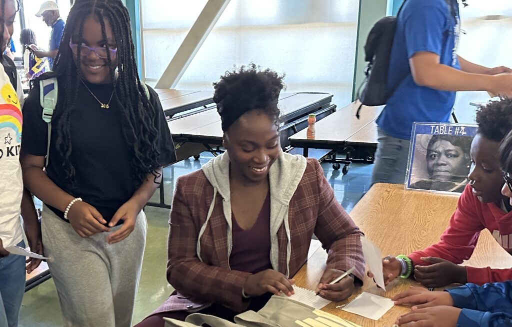 Olympian stops by Nystrom Elementary to read to students