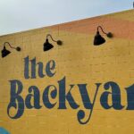 Harvest Festival brings a taste of Octoberfest to Rich City Harvest Festival brings a taste of Octoberfest to Rich City The Backyard will be celebrating a bounty of local craft beer and cider brewers Octoberfest-style at its first-ever “Harvest Festival” Sun., Oct. 1 from 12-8 p.m. at its Cutting Blvd. spread in Richmond. Beer and cider, food, live music and games will be on hand for the fall event, which will raise support for SOS Richmond (Safe Organized Spaces), an organization which helps people facing homelessness. East Brother Beer, Mare Island Brewing Co., Original Pattern Brewing Co., Berryessa Brewing Co. and the Far West Cider Co. will all be on sale as part of the day’s festivities at The Backyard. For those who haven’t passed it while cruising down Cutting Blvd., The Backyard is a food truck and beer/wine garden located in an outdoor, palm tree-lined lot. Check out its array of breakfast items, sandwiches, tartines and a kids’ menu offered here. “We will be collecting donations for Safe Organized Spaces Richmond and encourage our community to come out and support and learn more about this local organization doing incredible work,” stated The Backyard on Instagram about the event’s special cause. The Backyard is located at 205 Cutting Blvd. in Richmond. Learn more here.