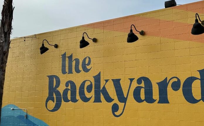 Harvest Festival brings a taste of Octoberfest to Rich City The Backyard will be celebrating a bounty of local craft beer and cider brewers Octoberfest-style at its first-ever “Harvest Festival” Sun., Oct. 1 from 12-8 p.m. at its Cutting Blvd. spread in Richmond. Beer and cider, food, live music and games will be on hand for the fall event, which will raise support for SOS Richmond (Safe Organized Spaces), an organization which helps people facing homelessness. East Brother Beer, Mare Island Brewing Co., Original Pattern Brewing Co., Berryessa Brewing Co. and the Far West Cider Co. will all be on sale as part of the day’s festivities at The Backyard. For those who haven’t passed it while cruising down Cutting Blvd., The Backyard is a food truck and beer/wine garden located in an outdoor, palm tree-lined lot. Check out its array of breakfast items, sandwiches, tartines and a kids’ menu offered here. “We will be collecting donations for Safe Organized Spaces Richmond and encourage our community to come out and support and learn more about this local organization doing incredible work,” stated The Backyard on Instagram about the event’s special cause. The Backyard is located at 205 Cutting Blvd. in Richmond. Learn more here.