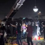 RFD uses ladder truck to suspend disco ball over roller skate dance party RFD ladder truck suspends disco ball over roller skate dance party