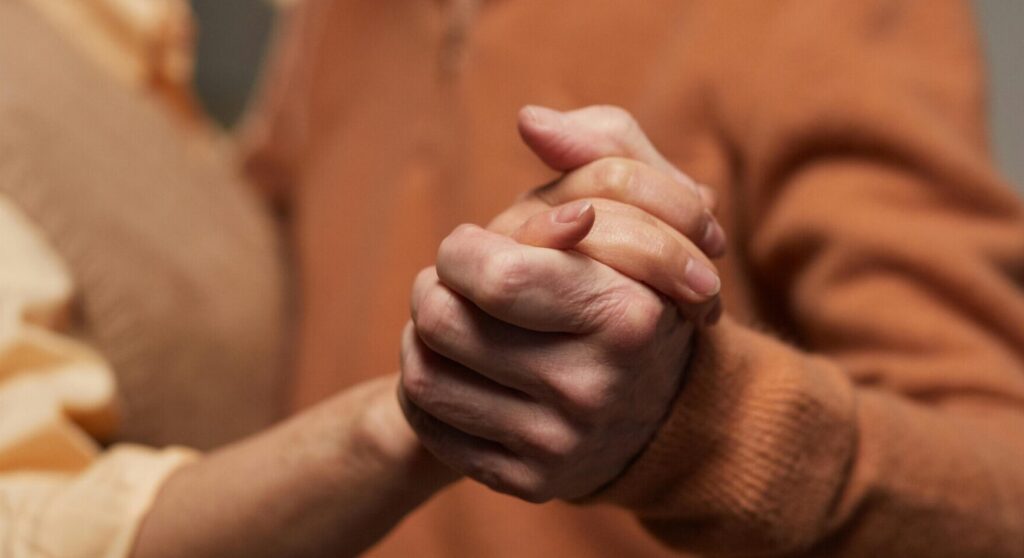 Photo by Marcus Aurelius: https://www.pexels.com/photo/couple-holding-each-other-s-hands-6788000/