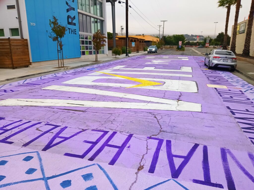 RYSE Center youth paint large street mural on National Voter Registration Day