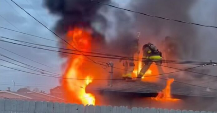 Occupants safely exit house fire pm 42nd Street