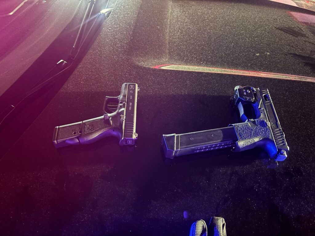 Two people were arrested after a traffic stop early Sunday uncovered two loaded firearms, including one equipped with an extended magazine and an illegal conversion device that allowed it to be fired fully automatic with one press of the trigger, according to the Richmond Police Department. The incident unfolded about 2 a.m. Sunday when officers were dispatched to a loud music complaint and a report of loitering in the parking lot in an apartment complex in the southern police district. Officers located a group of subjects near a vehicle, but the arrests didn't take place until about an hour later, when an officer spotted the same vehicle "aimlessly driving around" a nearby neighborhood, police said. The officer noticed the vehicle had expired registration, leading to a traffic stop. During the stop, the officer developed probable cause to search the vehicle, resulting in the recovery of the firearms. The driver initially provided a false name, but police would identify him and discover he had three out-of-state warrants, with alerts indicating he is known to carry firearms. "Both individuals were booked on multiple firearm-related charges, including possession of a machine gun," police said.