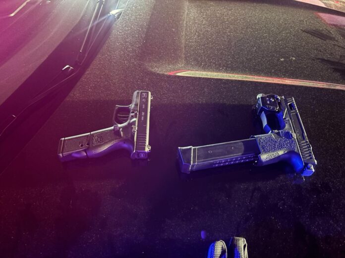 Two people were arrested after a traffic stop early Sunday uncovered two loaded firearms, including one equipped with an extended magazine and an illegal conversion device that allowed it to be fired fully automatic with one press of the trigger, according to the Richmond Police Department. The incident unfolded about 2 a.m. Sunday when officers were dispatched to a loud music complaint and a report of loitering in the parking lot in an apartment complex in the southern police district. Officers located a group of subjects near a vehicle, but the arrests didn't take place until about an hour later, when an officer spotted the same vehicle "aimlessly driving around" a nearby neighborhood, police said. The officer noticed the vehicle had expired registration, leading to a traffic stop. During the stop, the officer developed probable cause to search the vehicle, resulting in the recovery of the firearms. The driver initially provided a false name, but police would identify him and discover he had three out-of-state warrants, with alerts indicating he is known to carry firearms. "Both individuals were booked on multiple firearm-related charges, including possession of a machine gun," police said.