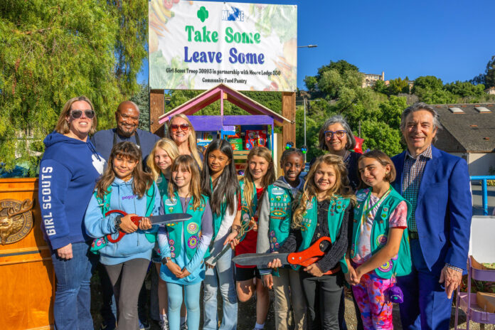 Junior Girls Scouts’ cookie power builds food pantry