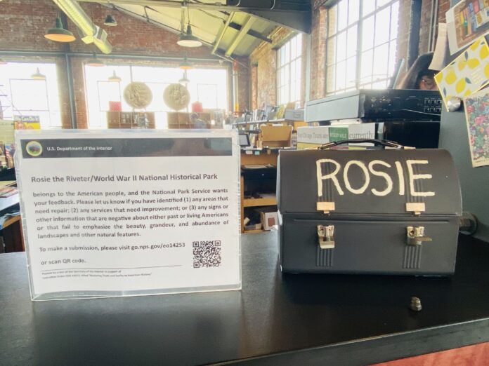 Federally mandated Rosie the Riveter sign draws attention