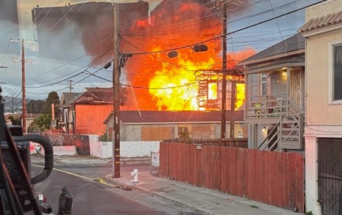 Remnants of Historic International Hotel collapse in fire