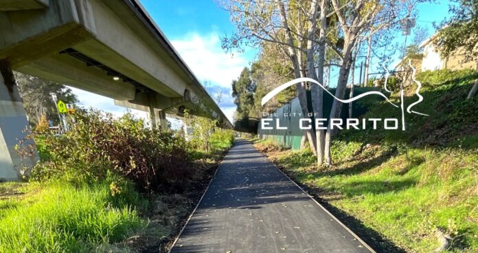 The City of El Cerrito announced this week the completion of the 2025 Ohlone Greenway Repair Project, in which crews repaved 500 linear feet of pathway near Centennial Park, between Stockton Avenue and Lincoln Avenue, fixing damage caused by water intrusion and tree roots. The Ohlone Greenway is a multi-use pedestrian and bicycle corridor running roughly 2.7 miles through El Cerrito under and beside the elevated BART tracks, connecting neighborhoods and two BART stations. It follows an old railroad right-of-way and is named for the Ohlone people, the area’s original Indigenous inhabitants.